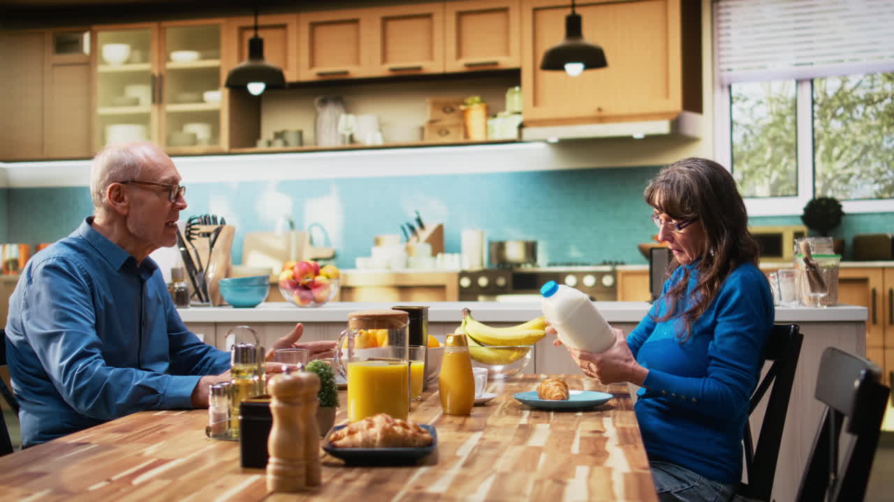 Old man and woman reading ingredients on organic product label