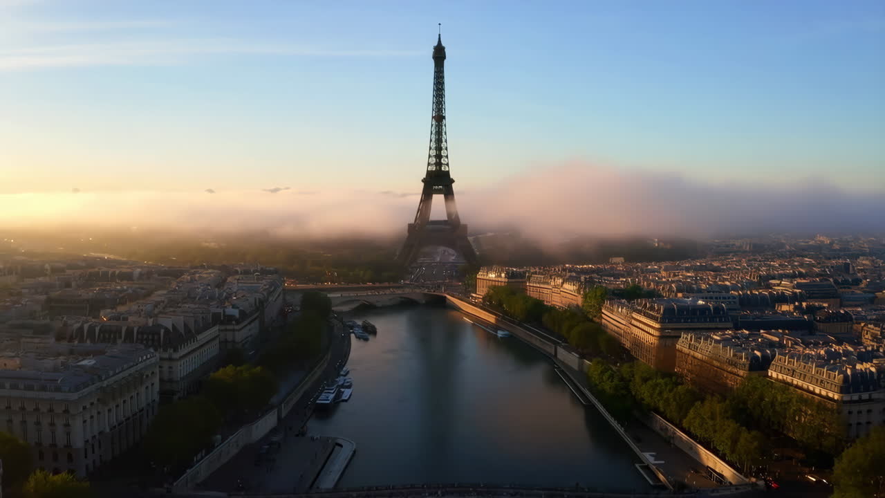 Eiffel Tower and Seine River at Sunrise in Foggy Paris