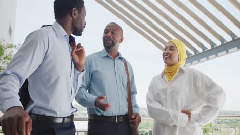 happy diverse business people discussing work at office, slow motion