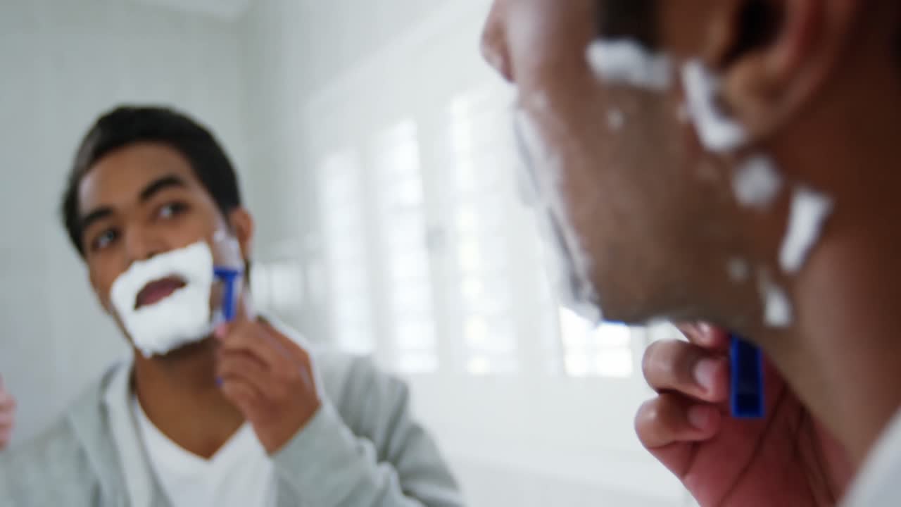 Man shaving in the bathroom