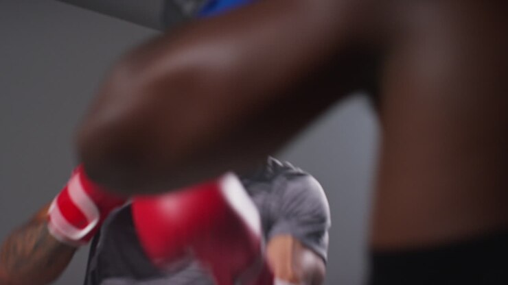 Close Up Shot Of Male Boxer Sparring Working Out With Trainer Wearing Punch Mitts Or Gloves Practising For Fight 3