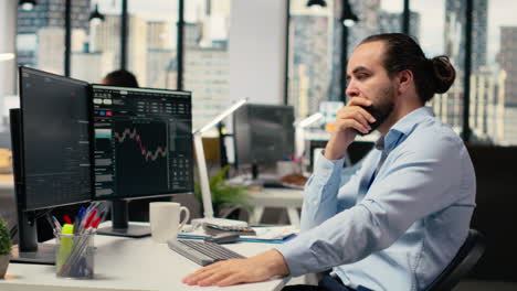 trader in office expresses concern as investment portfolio value declines