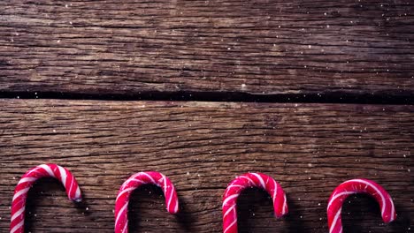 falling snow with christmas candy decorations