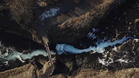 stunning sightseeing bridge bruarfoss in iceland, aerial top down panorama