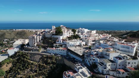 Mojacar-White-Coastal-Village-on-Top-of-a-Hill-in-Almeria,-Andalusia,-Spain---Aerial-4k