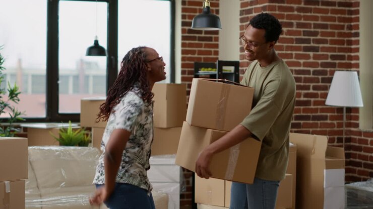 Married couple feeling excited about having keys of new apartment