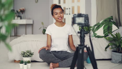 young woman vlogging from home