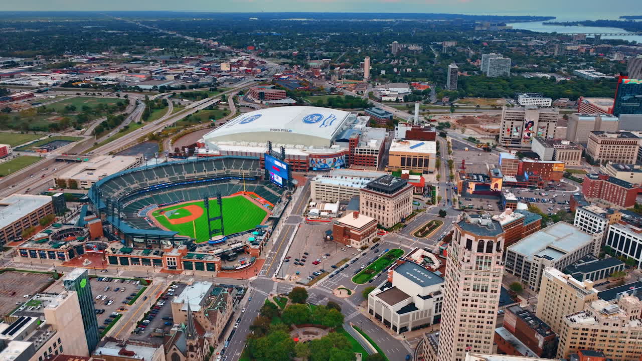 Approaching Detroit sport arenas and stadiums. Drone footage over the city in Michigan, USA