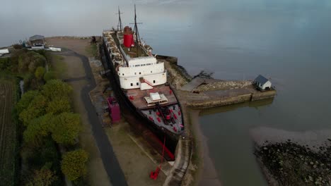 The-former-railway-steamer-passenger-ship-TSS-Duke-of-Lancaster-beached-near-Mostyn-Docks-in-North-Wales---aerial-shot