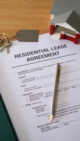 vertical shot of residential lease agreement documents. concept of renting a home.