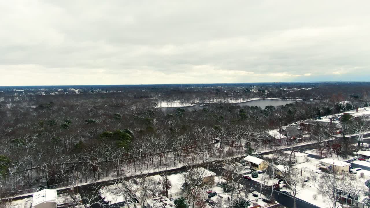 Snow covered middle class suburban neighborhood West Babylon New York United States, aerial