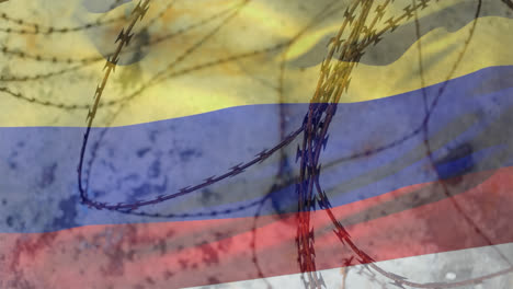 alambre de púas contra la bandera de colombia