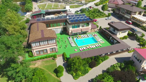 Aerial View of a Resort with Pool and People