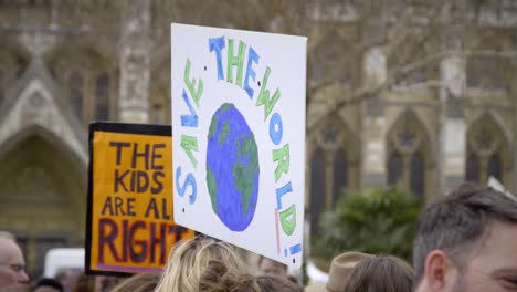 save the world protest sign