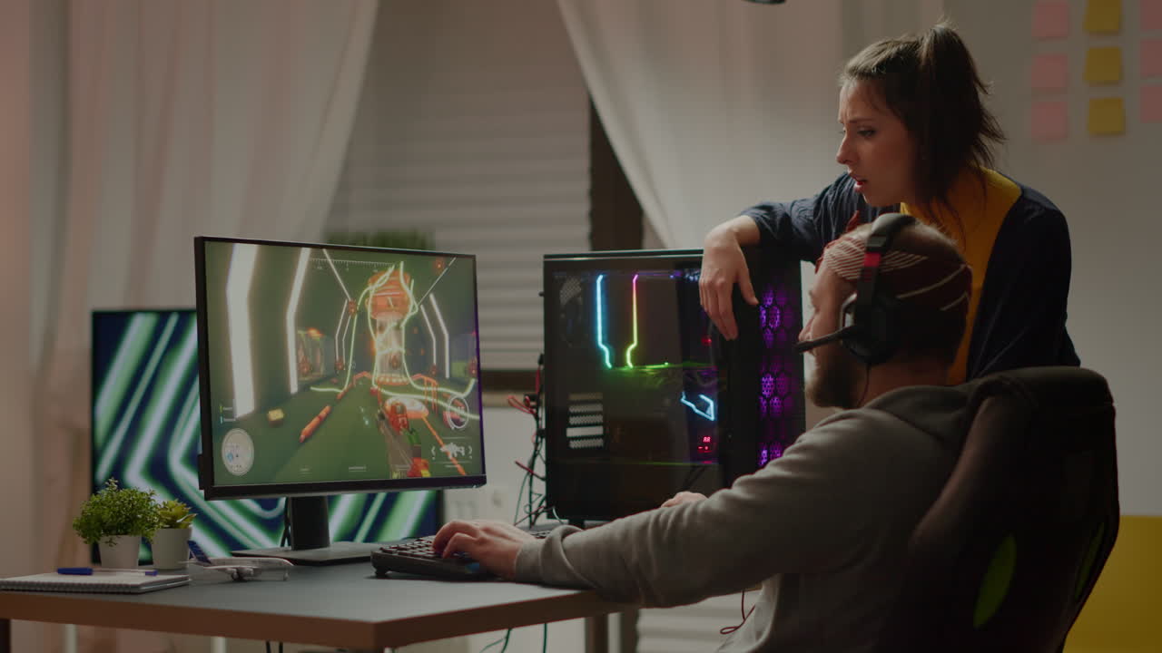 프로게이머 부부가 1인칭 슈팅 비디오 게임을 잃고 있습니다.