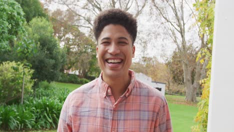 video of biracial smiling men in the garden