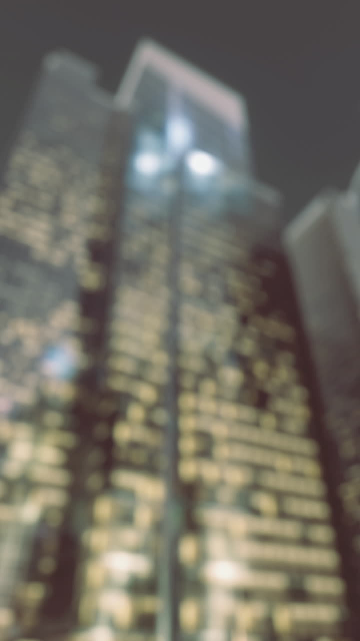 City skyline glimmers at dusk with vibrant urban lights reflecting dreams