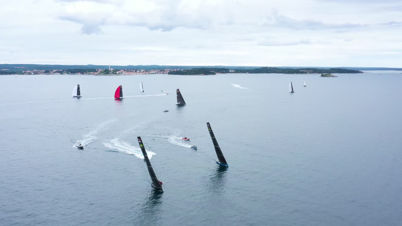 Race Sailboats sailing in Regatta RC44 Rovinj Croatia - Aerial Drone View