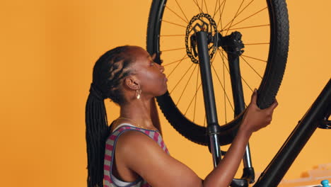 technician fixing faulty bicycle tires and servicing damaged rear derailleur