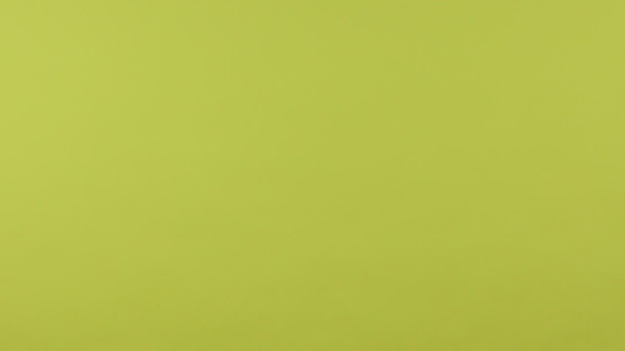Profile closeup female hand holding and showing horizontal smartphone with green screen