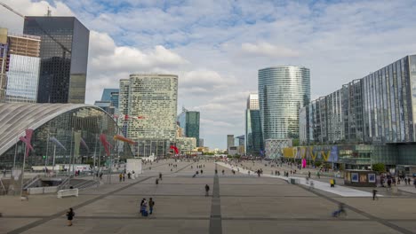 large pedestrian square in parisian district of la defense. time lapse