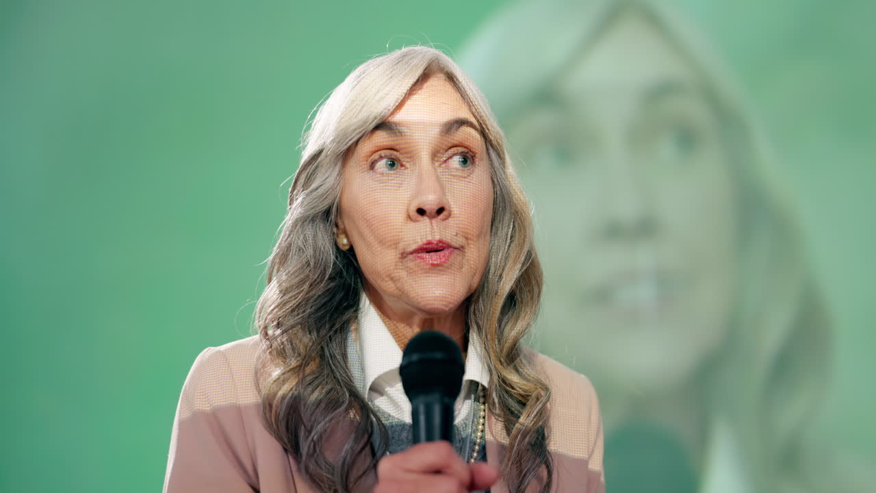 A woman giving a speech at a conference