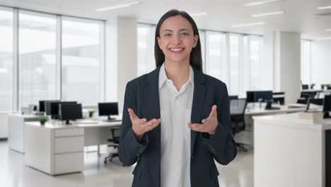 Happy-Indian-female-manager-talking-to-the-camera