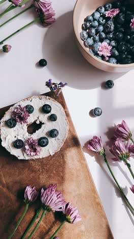 blueberry cream cheese bagel with flowers