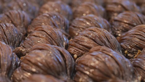 dolly fires. turkish baklava shell with cocoa filling and ground hazelnuts. brown baklava with natural ingredients. close-up. shallow depth of field. 4k