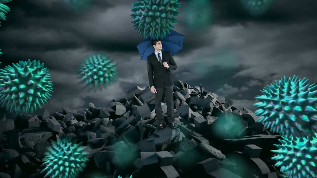 Multiple covid-19 cells floating over businessman holding an umbrella standing on broken rocks
