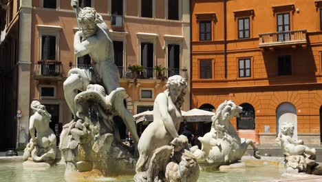 close up of the statues of the fountain of the neptune in piazza navona, rome, italy