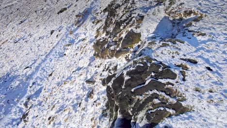 Cinematic-cold-English-winter-moorland-aerial-view,-Aerial-Winter-snow-scene