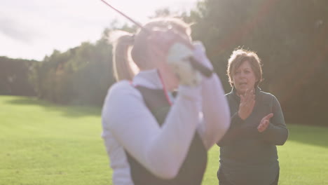 women golfing