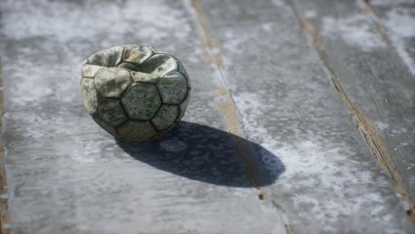 old soccer ball the cement floor