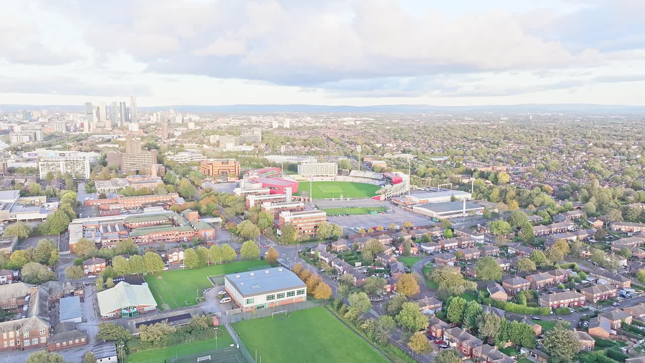 Manchester's city residential area with Old Trafford Cricket Ground aerial shot with highrise buildings in the background