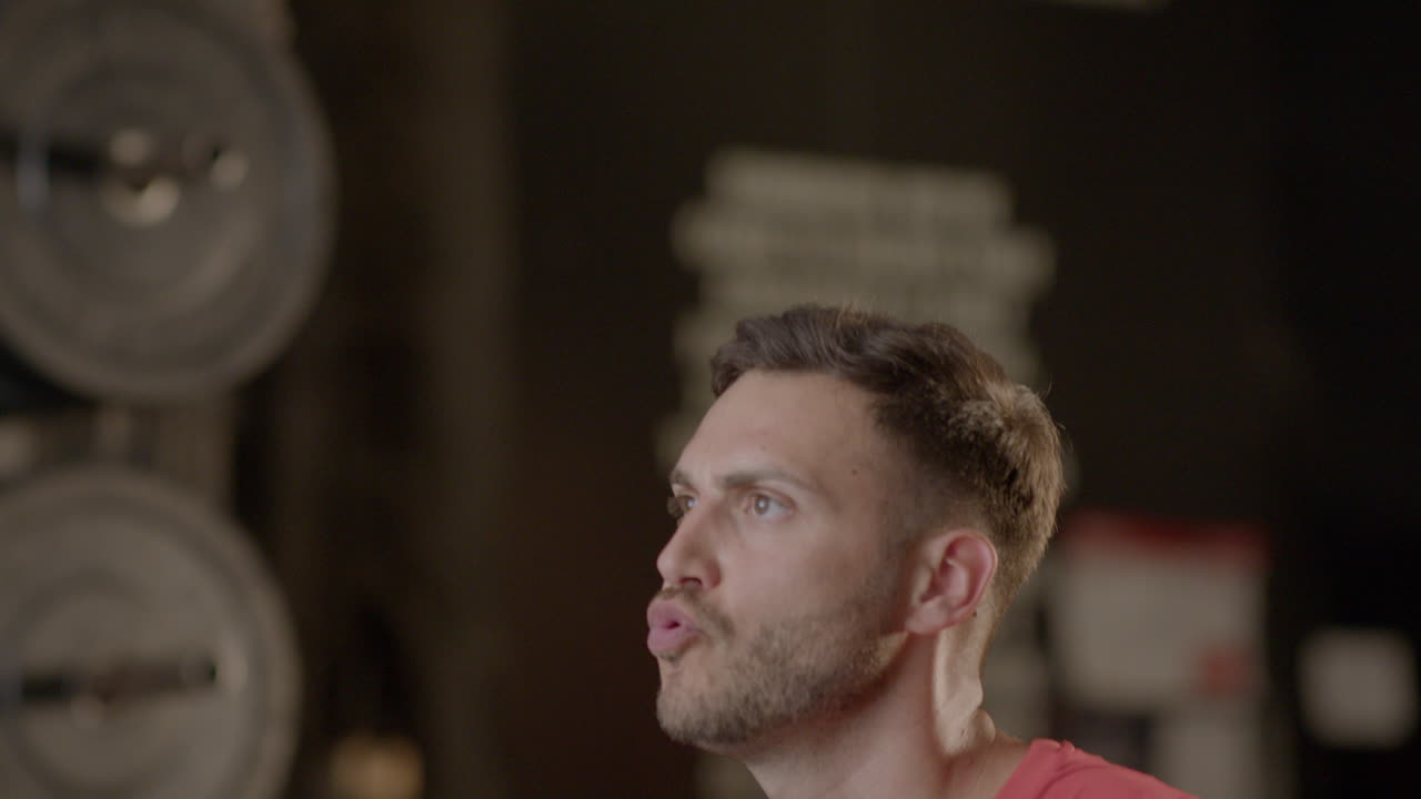 Man Weight Training at the Gym