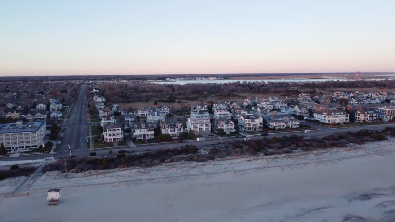 A beautiful aerial drone shot, flying towards beachfront houses in Cape May New Jersey, Cape May County