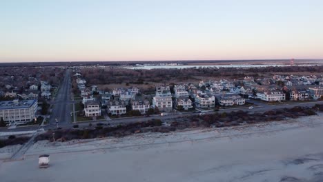 A-beautiful-aerial-drone-shot,-flying-towards-beachfront-houses-in-Cape-May-New-Jersey,-Cape-May-County