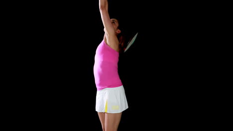 una jugadora de tenis muy guapa calentándose.