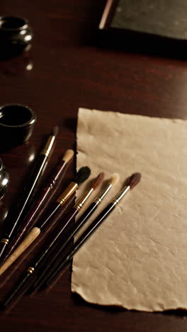art supplies on dark wooden table