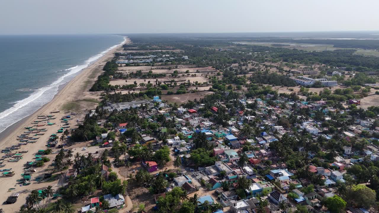 Aerial footage of the scenic near to East Coast Road (ECR) as it winds through a traditional fishing village on the border of Tamil Nadu and Puducherry