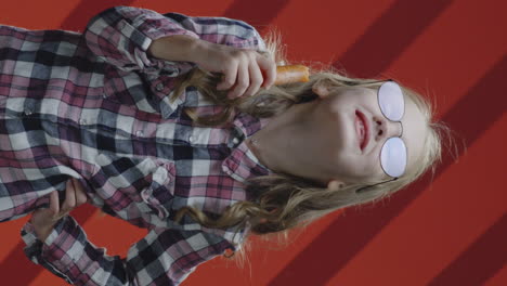 girl eating a carrot
