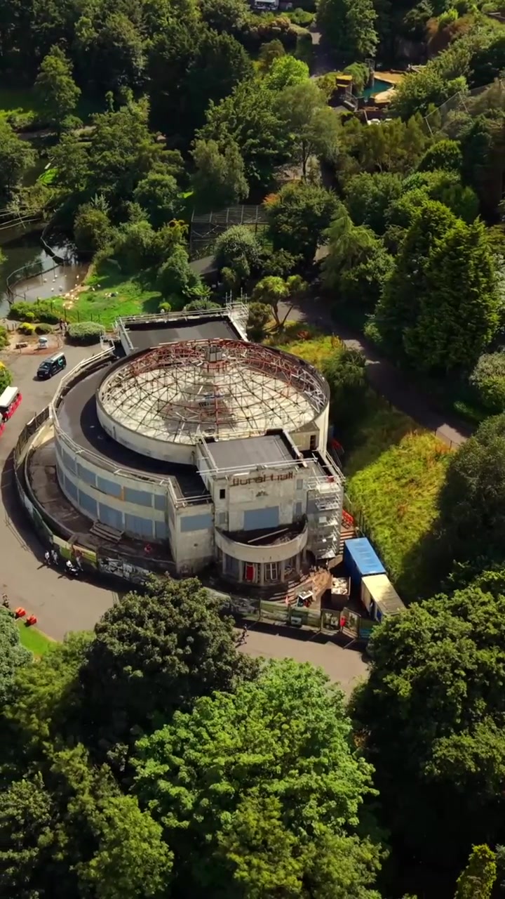 Anti-clockwise 60FPS vertical social ratio aerial video of Belfast Zoo and Cavehill in North Belfast, Northern Ireland in the UK on a bright sunny day. Produced with Rec709 colour.