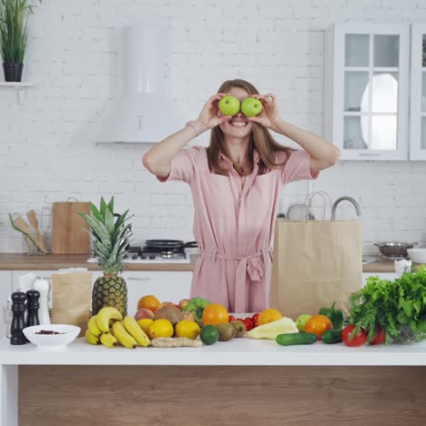 Pretty woman standing in kitchen