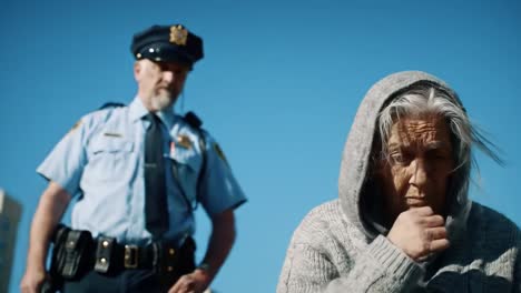 an elderly woman sits in the foreground, reflecting on life, while a police officer stands in the background, observing the scene, showcasing the dynamics of society and law enforcement.