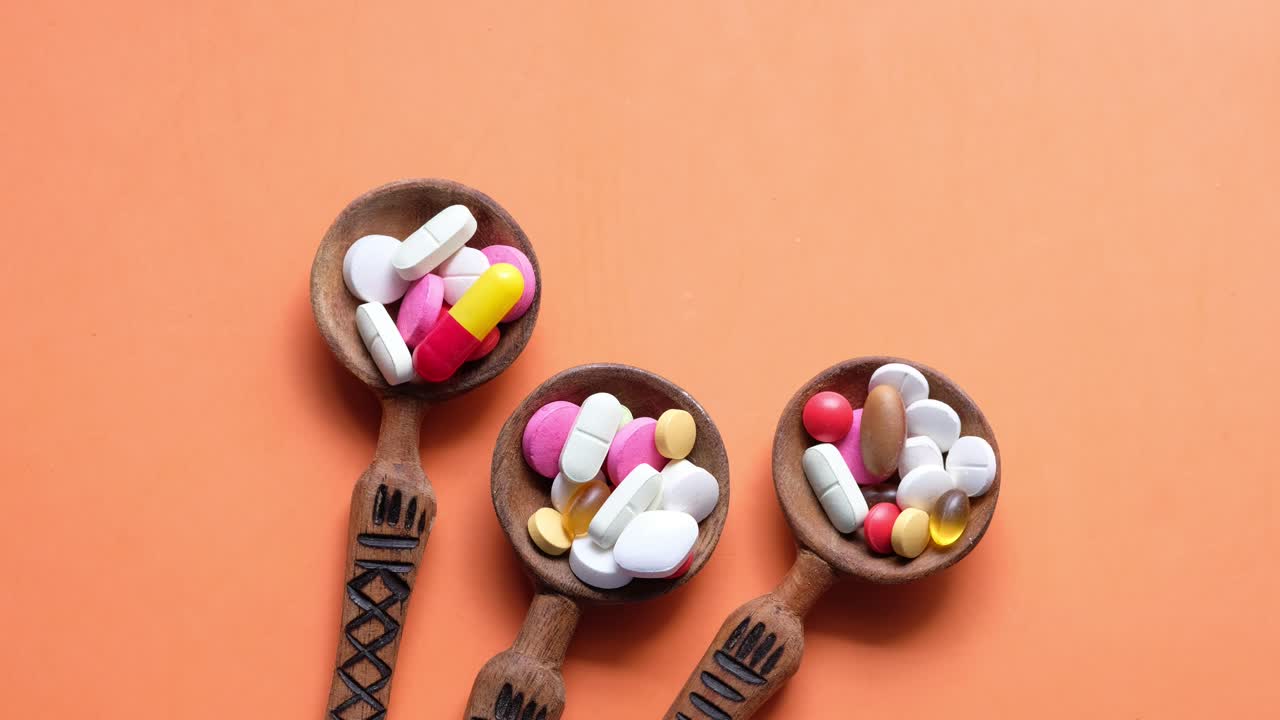 Wooden Spoons Filled with Assorted Pills