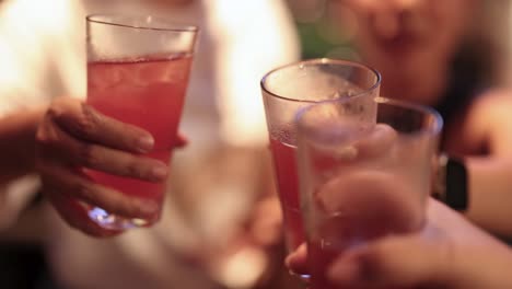 friends toasting with wine and cocktails