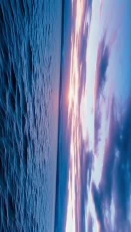 vibrant sunset and ethereal clouds over water