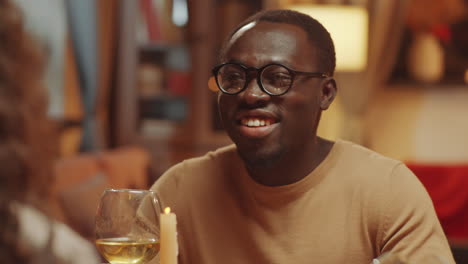 Black-Man-Drinking-Wine-And-Chatting