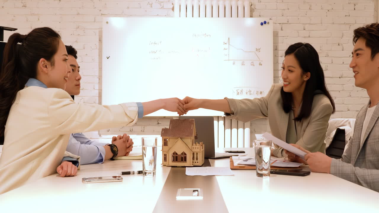 At Modern space office, business people seller explain to buyer or mortgage, signing on house purchase contract agreement for loan financial, pay cash money for real estate house properties, handshake